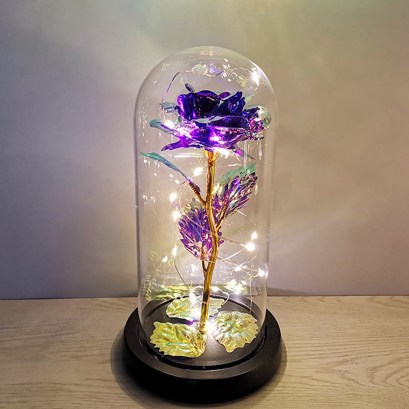 La rose en or sous couverture en verre avec éclairage Led