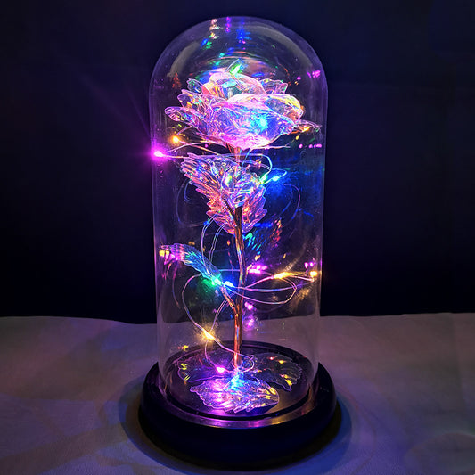 La rose en or sous couverture en verre avec éclairage Led