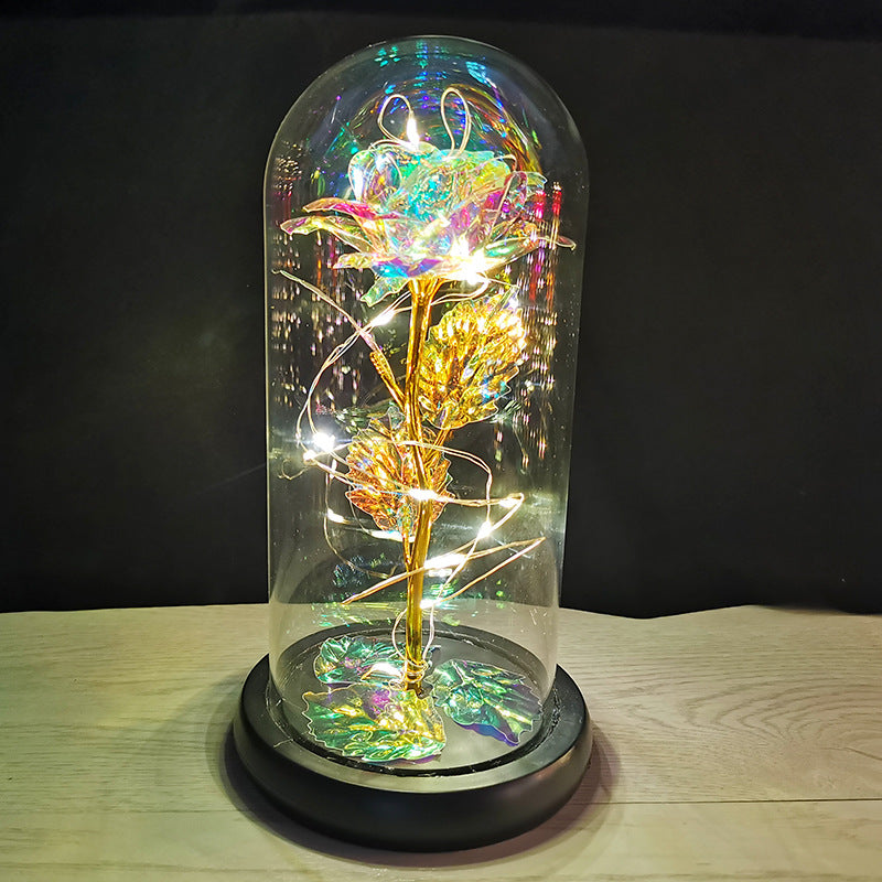 La rose en or sous couverture en verre avec éclairage Led