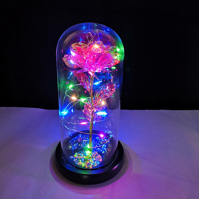 La rose en or sous couverture en verre avec éclairage Led