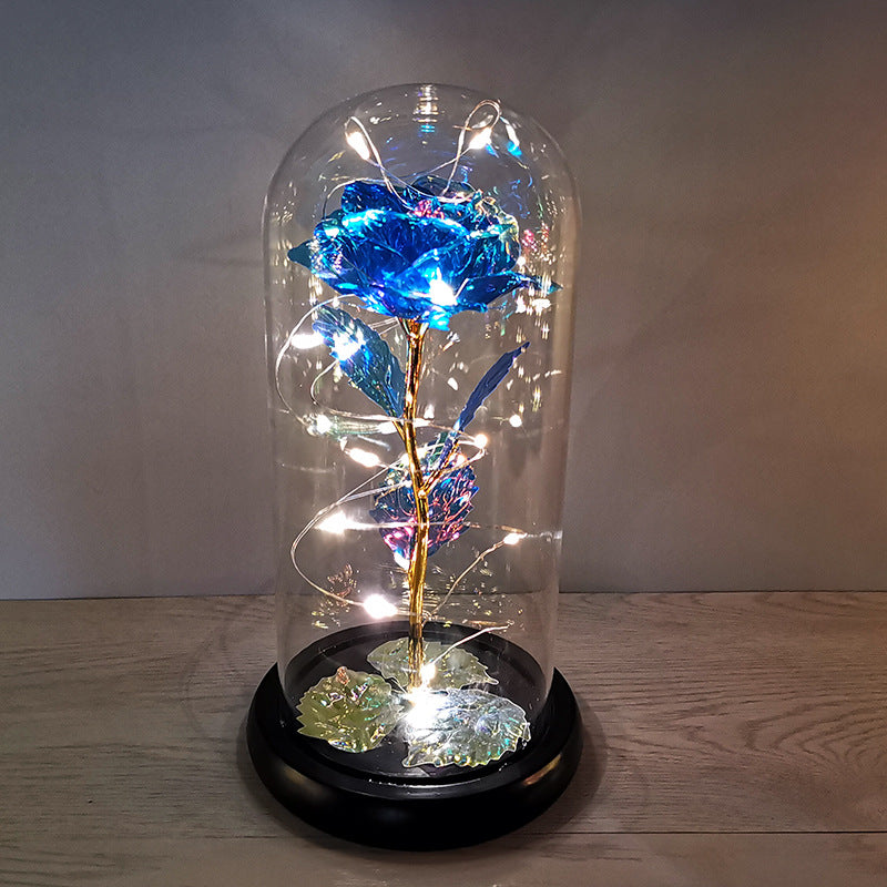 La rose en or sous couverture en verre avec éclairage Led