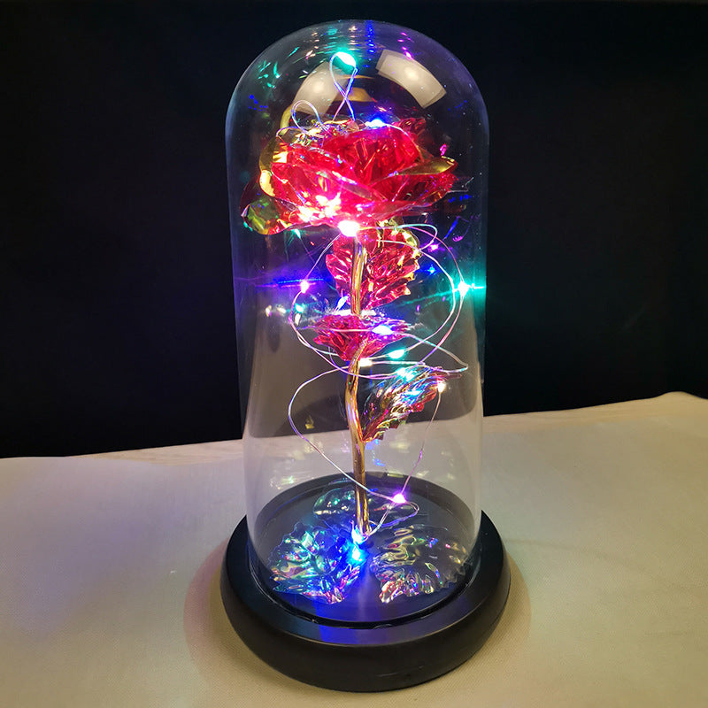 La rose en or sous couverture en verre avec éclairage Led