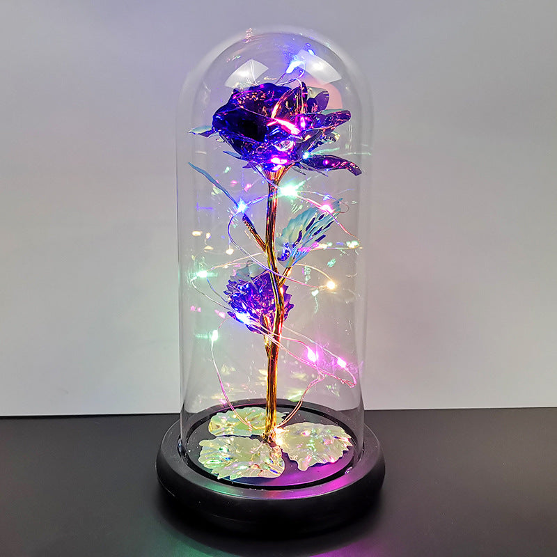 La rose en or sous couverture en verre avec éclairage Led